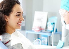 Young woman smiling at dentist