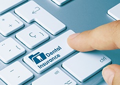Patient in Waverly checking dental insurance for dental implants