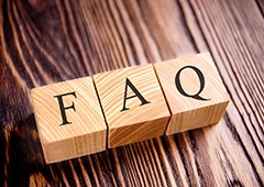 Wooden blocks showing the letters F A and Q