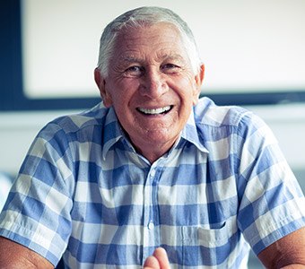 man in white and blue plaid shirt