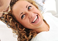 woman with curly hair smiling