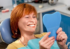 woman smiling in blue mirror