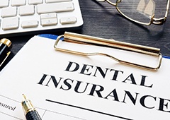 Dental insurance paperwork lying on table