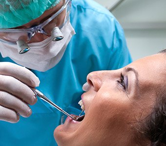 Dentist examining a smile during preventive dentistry visit