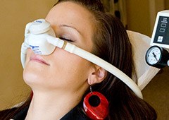 Woman with nitrous oxide mask on her face