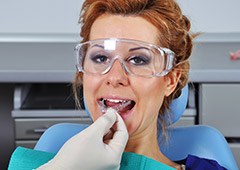 Dentist placing mouthguard in a patient's mouth