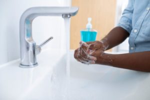 person washing their hands in a bathroom