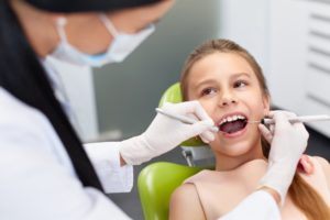 A young child at her dental exam.